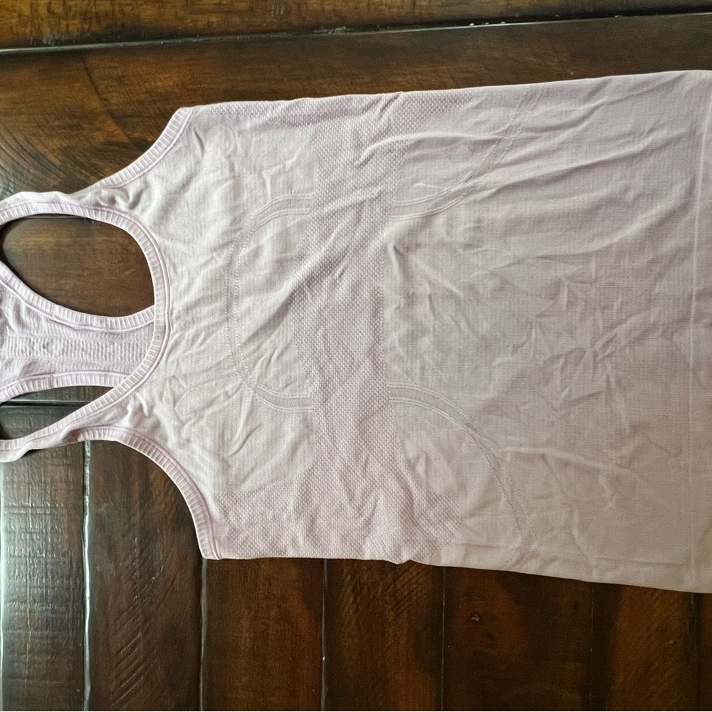 Women's lulu lemon light lavendar racerback tank top. No built in bra.